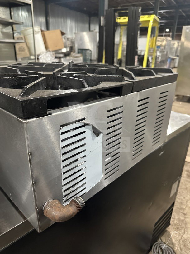 L&J Bunn stainless steel 4-burner gas countertop hot plate, commercial use. Shows minor wear, visible front ventilation.