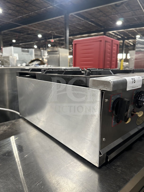 L&J Bunn stainless steel 4-burner gas countertop hot plate, commercial grade, with control knobs, in good condition.