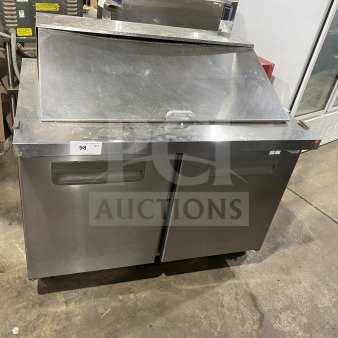 Coldline SMP-48-18A stainless steel 2-door refrigerated prep table on casters, suitable for salads/sandwiches, visible wear.
