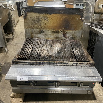 Vulcan stainless steel countertop gas charbroiler with backsplash, used condition, visible controls, item label "99 Qty".