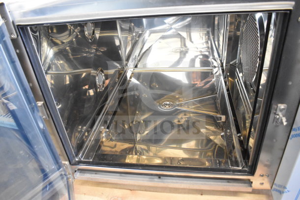 Brand new Blodgett KPE-gas 2.06/BCT 62 combi convection oven interior, stainless steel, scratch and dent condition.