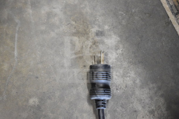 Power plug for Blodgett KPE-gas 2.06/BCT 62 convection oven, showing standard three-prong design, resting on concrete floor.
