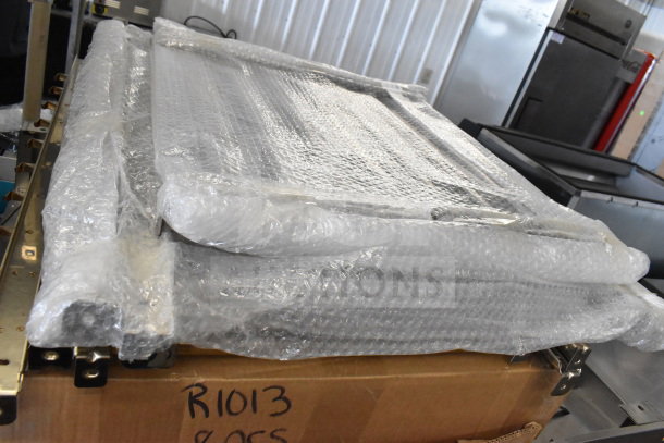Brand new Blodgett Invoq Combi Convection Oven, wrapped in bubble wrap. Box marked "R1013". Slightly damaged packaging.