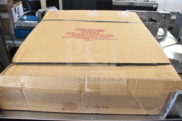 Boxed Blodgett Invoq Commercial Combi Convection Oven with slight dents. New condition, Blodgett logo visible.