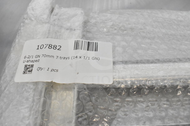 Brand new Blodgett Invoq commercial combi convection oven, wrapped in bubble wrap. Tag shows model 107882, 7 trays, U-shaped.