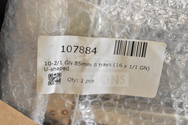 Brand new Blodgett Invoq combi convection oven sealed in bubble wrap. Label shows model 107884, 8 trays, U-shaped.