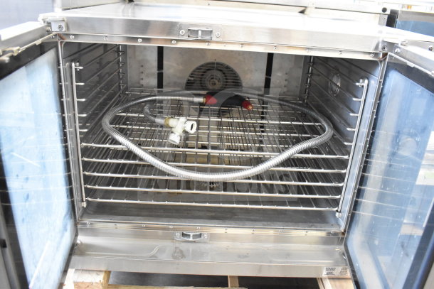 Brand new Blodgett HV100G gas convection oven, 60,000 BTU, with view-through doors and thermostatic controls, interior view.