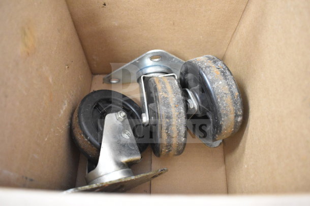 Box containing caster wheels for Blodgett HV100G convection oven. Wheels show rust; necessary for movement and installation.