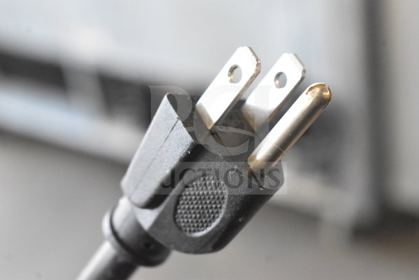 Close-up of a power plug for the Varimixer V20A dough mixer, 115 volts, with a visible prong design.