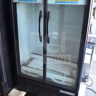 Brand new True TVM-36SL-HC commercial 2-door reach-in cooler merchandiser, 115V, 1 phase, minor scratches and dents.