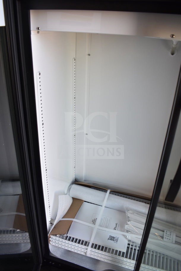 Brand new True TVM-36SL-HC 2-door reach-in cooler, 115V, with minor scratches and dents, interior view.