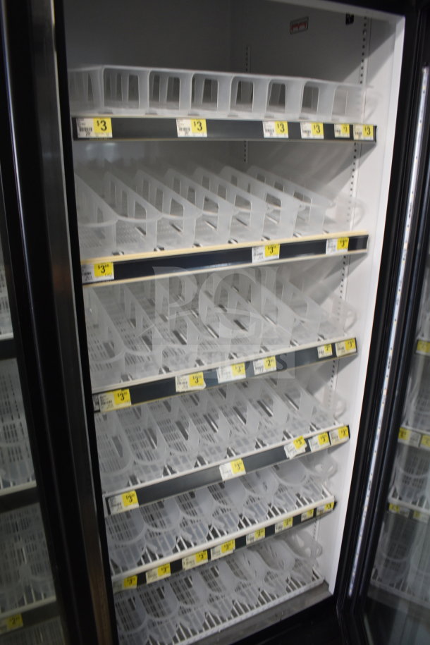 2018 True GDM-72-HC commercial cooler with three glass doors, empty shelves, and clear $3 price tags visible. 115V, 1 phase.