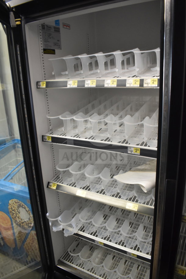 2018 True GDM-72-HC commercial 3-door cooler merchandiser, 115 volts, 1 phase. Clear shelving, interior tags for pricing.