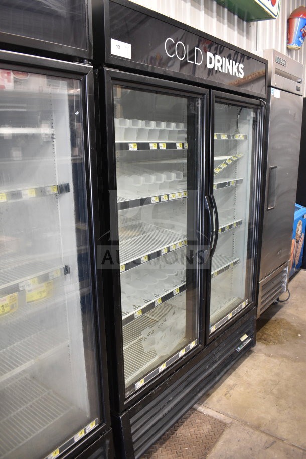 2018 True GDM-49-HC commercial 2-door cooler, black exterior, glass doors, 115 volts, labeled "Cold Drinks".