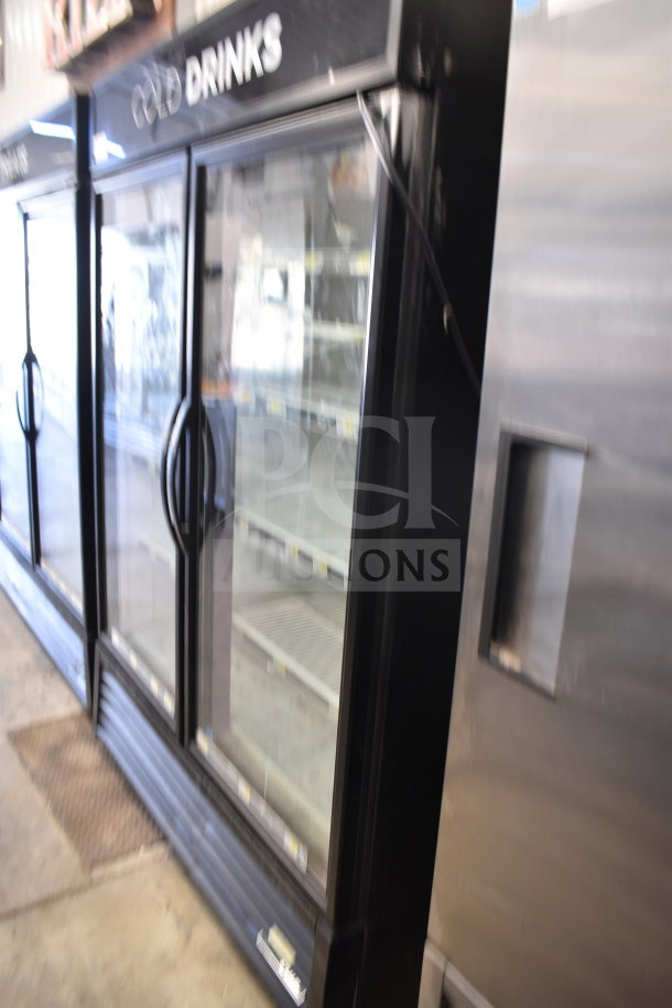 2018 True GDM-49-HC commercial cooler, 2 glass doors, black frame, interior shelving, "Cold Drinks" label, 115 volts, 1 phase.