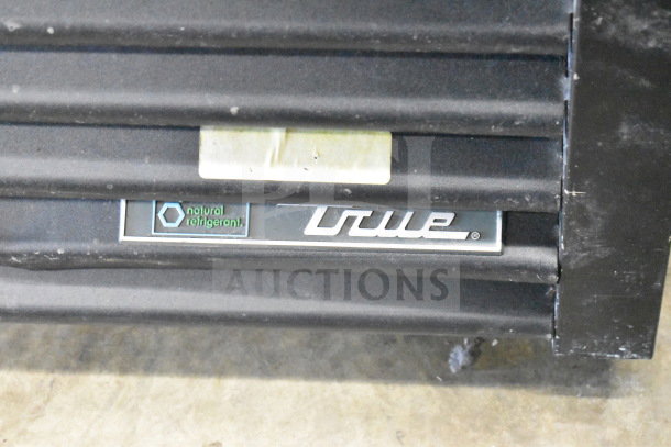 2018 True GDM-49-HC commercial cooler label showing "natural refrigerant" and branding. Model for 115 volts, 1 phase.