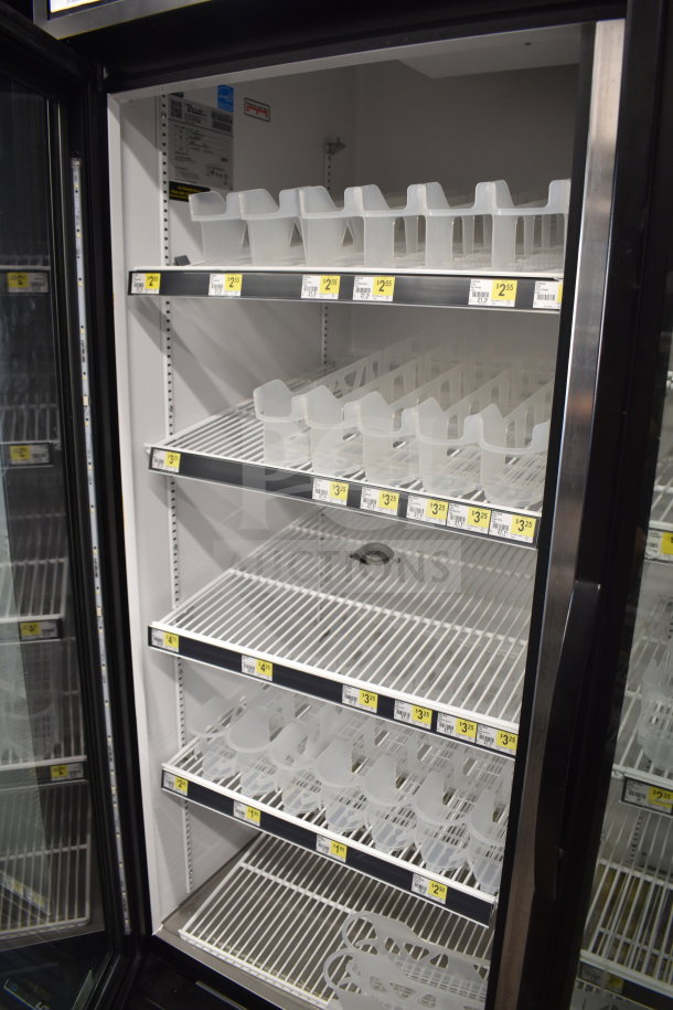2018 True GDM-49-HC 2 Door Commercial Cooler, features adjustable shelves, 115V, clean interior, model label visible.