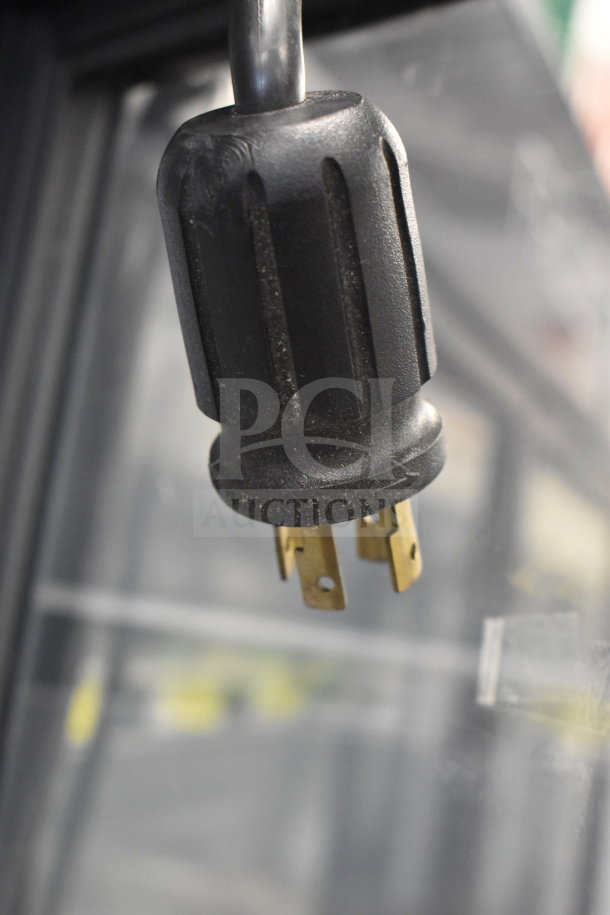 Close-up of an electrical plug of the 2018 True GDM-72F-HC commercial freezer. Plug suitable for 115/208-230 volts, 1 phase.