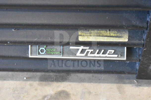 2018 True GDM-72F-HC freezer bottom, showcasing "True" logo and "natural refrigerant" label.