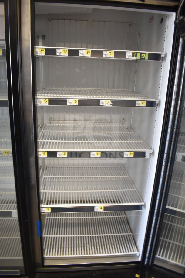 2018 True GDM-72F-HC commercial freezer with 3 glass doors, wire shelving, and visible price tags; 115/208-230 volts, 1 phase.