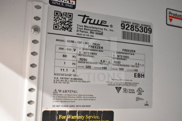 Label on 2018 True GDM-72F-HC freezer merchandiser showing model details, voltage, refrigerant type, and certifications.