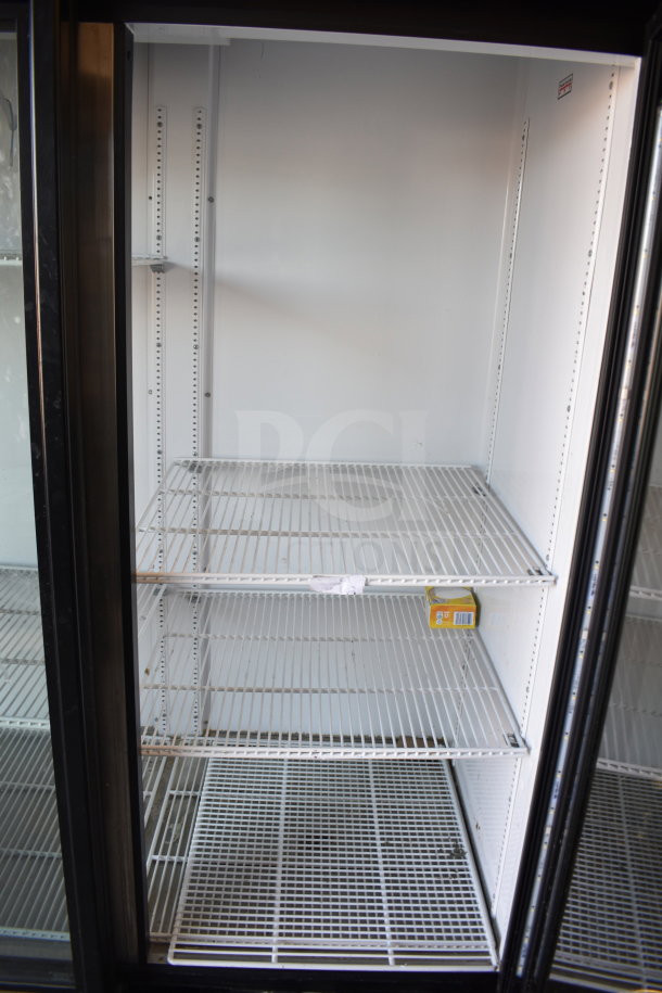 2019 True GDM-72-HC commercial 3-door reach-in cooler, white interior, shelving, 115/208-230V, 1 phase, clean condition.