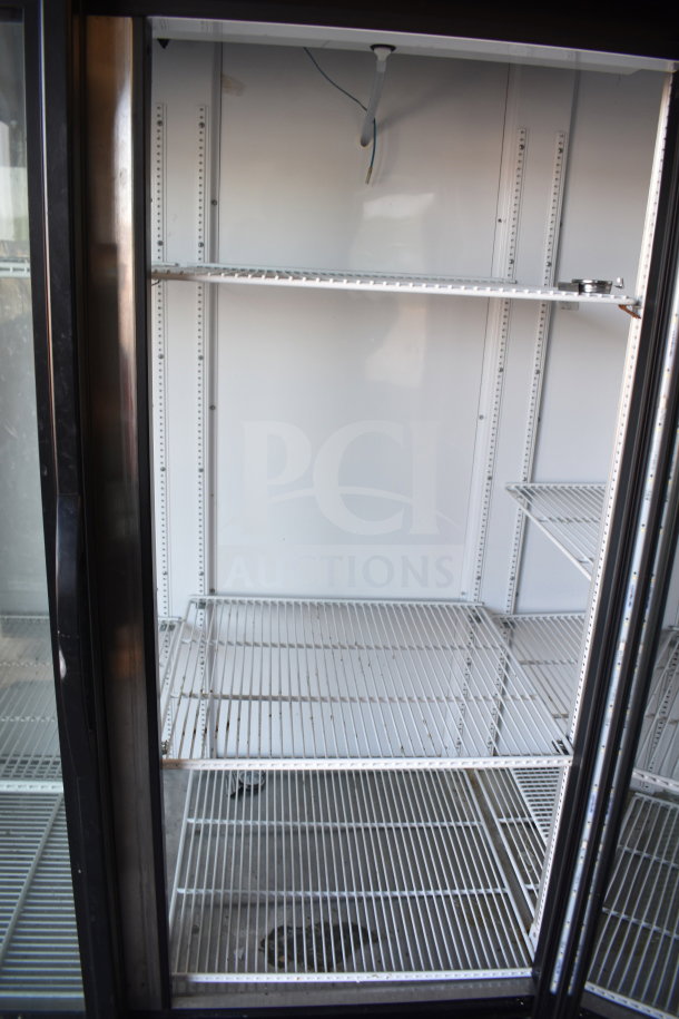 2019 True GDM-72-HC 3 Door Reach-In Cooler Merchandiser, excellent condition, adjustable shelves, 115/208-230 Volts.