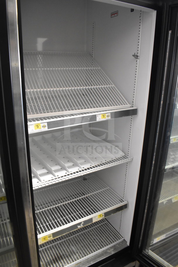 2018 True GDM-72-HC commercial 3-door reach-in cooler merchandiser, 115/208-230 volts, 1 phase, spotless interior shelves.