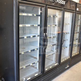 2018 True GDM-72F-HC 3-door reach-in freezer, black frame, glass doors, commercial use, 115 volts, 1 phase.
