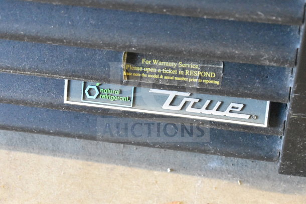 True GDM-72F-HC freezer label with "natural refrigerant" marking and warranty service instructions.