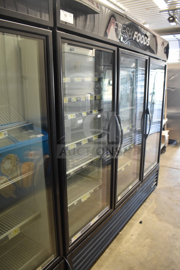 2018 True GDM-72-HC commercial cooler, 3-door reach-in, glass display, used condition, holds 115V, 1 phase, "Fresh Foods" marked.