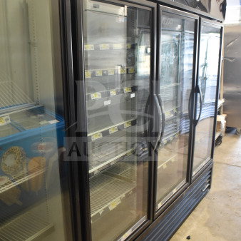 2018 True GDM-72-HC commercial cooler, 3-door reach-in, glass display, used condition, holds 115V, 1 phase, "Fresh Foods" marked.