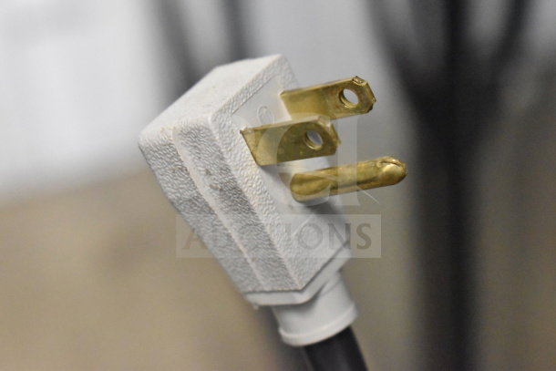 Close-up of a power plug for the 2018 True GDM-72-HC Commercial 3 Door Cooler, showing a three-pronged plug.