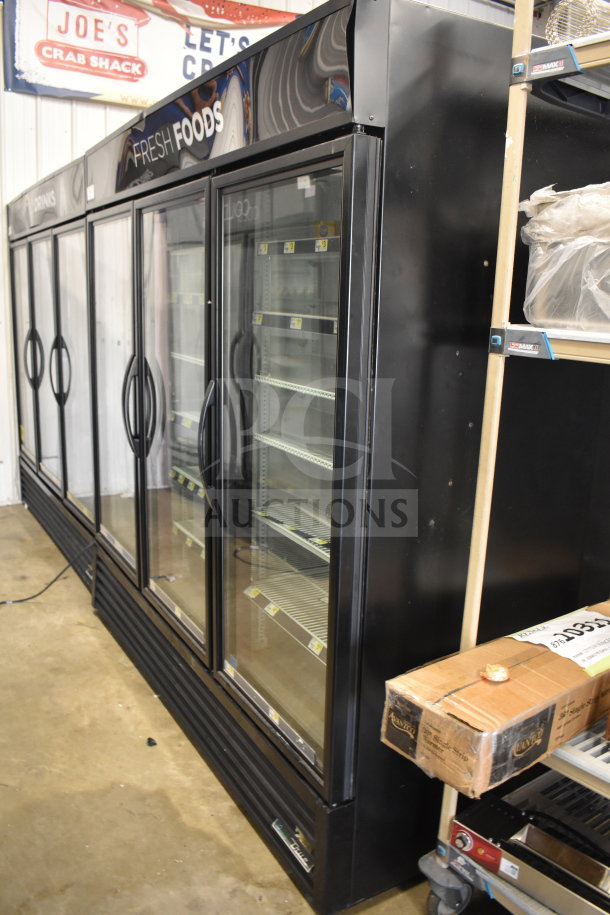 2018 True GDM-72-HC 3-door cooler merchandiser, black, glass doors, shelves visible, commercial-grade, 115V, 1 phase.