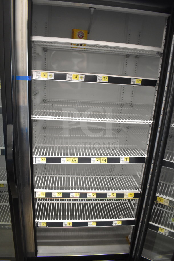 2018 True GDM-72-HC 3 door cooler merchandiser, 115V, 1 phase, multiple shelves, visible price labels, commercial use.
