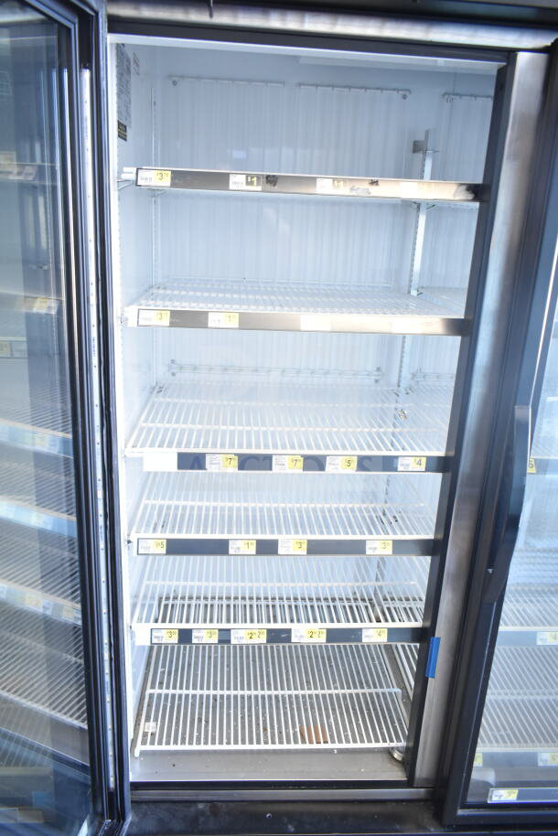 2018 True GDM-72F-HC commercial 3-door freezer, glass doors, white interior, shelving, 115/208-230V, 1 phase.