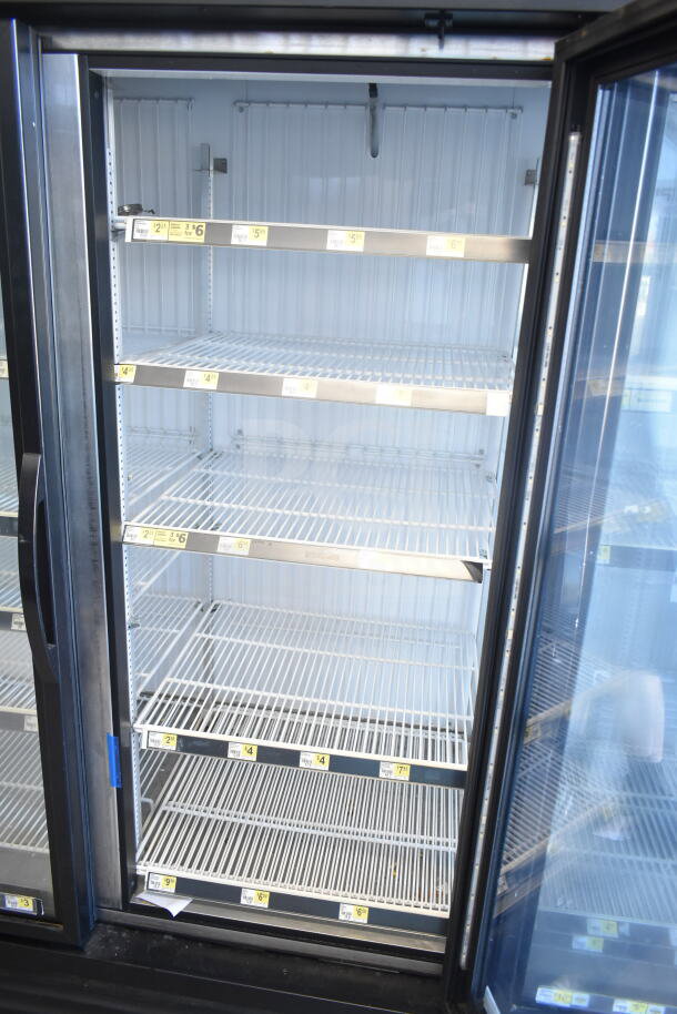 2018 True GDM-72F-HC commercial 3-door reach-in freezer merchandiser, interior shelves, glass doors, excellent condition.