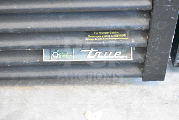 2018 True GDM-72-HC cooler vent; "natural refrigerant" and "True" labels visible; warranty service notice above.