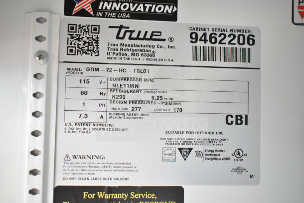 Label on 2018 True GDM-72-HC commercial cooler; details voltage, refrigerant type R290, and compressor model NLE11MN.