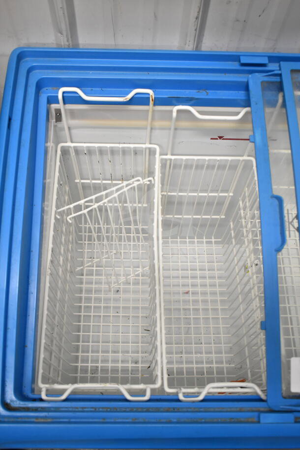Commercial chest freezer merchandiser with blue trim, interior baskets, on commercial casters, 115 Volts, 1 Phase.