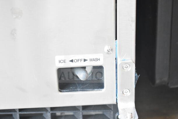 Hoshizaki AM-50BAK ice machine control panel close-up, showing "Ice," "Off," "Wash" switch labels. Stainless finish.