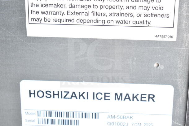 2025 Hoshizaki AM-50BAK undercounter ice machine label, model and serial number visible, silver finish.