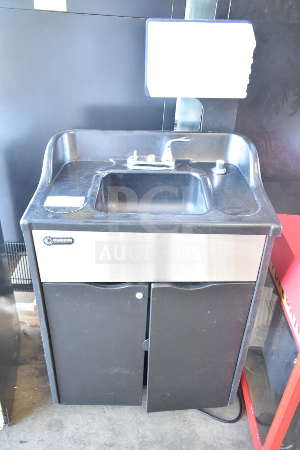Ozark River Portable Sink on commercial casters, black finish, stainless steel front, faucet, under-sink storage, clean condition.