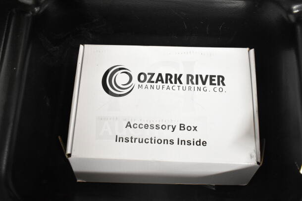 Ozark River Portable Sink accessory box with instructions inside, shown with commercial casters.