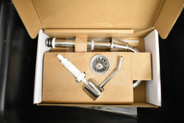 Ozark River Portable Sink components in box, including faucet and drain parts, for installation on commercial casters.