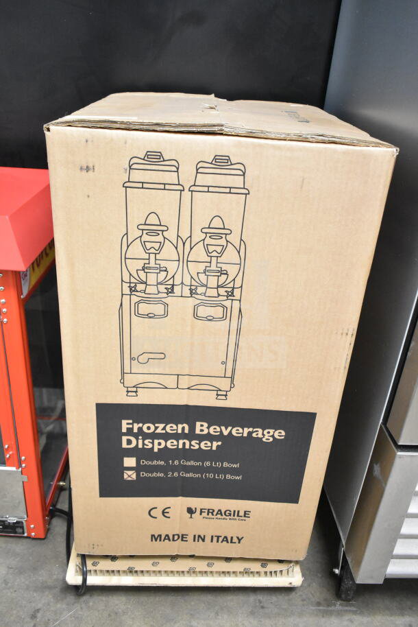 Boxed Carnival King Oasis 2-10 granita machine, 2.6-gallon double bowls, pourover, 120 volts, brand new, scratch and dent.