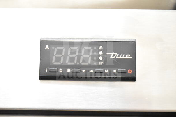2023 True T-23-HC cooler digital display panel, showing controls and True logo.