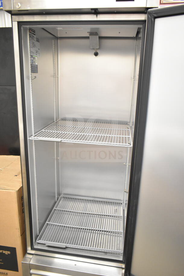 2023 True T-23-HC commercial single door cooler, stainless steel interior, 115 volts, excellent condition with two shelves.