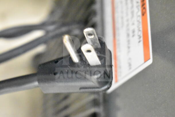 Close-up of the power plug for a 2023 True T-23-HC commercial single door reach-in cooler showing 115 volts, 1 phase connection.