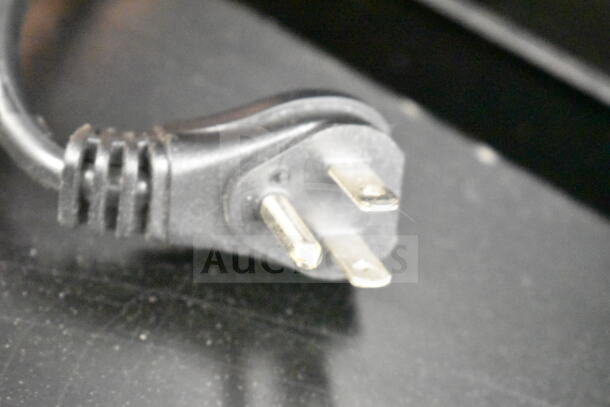 Close-up of a standard three-prong power plug for the Liebherr VC213263000 commercial cooler.